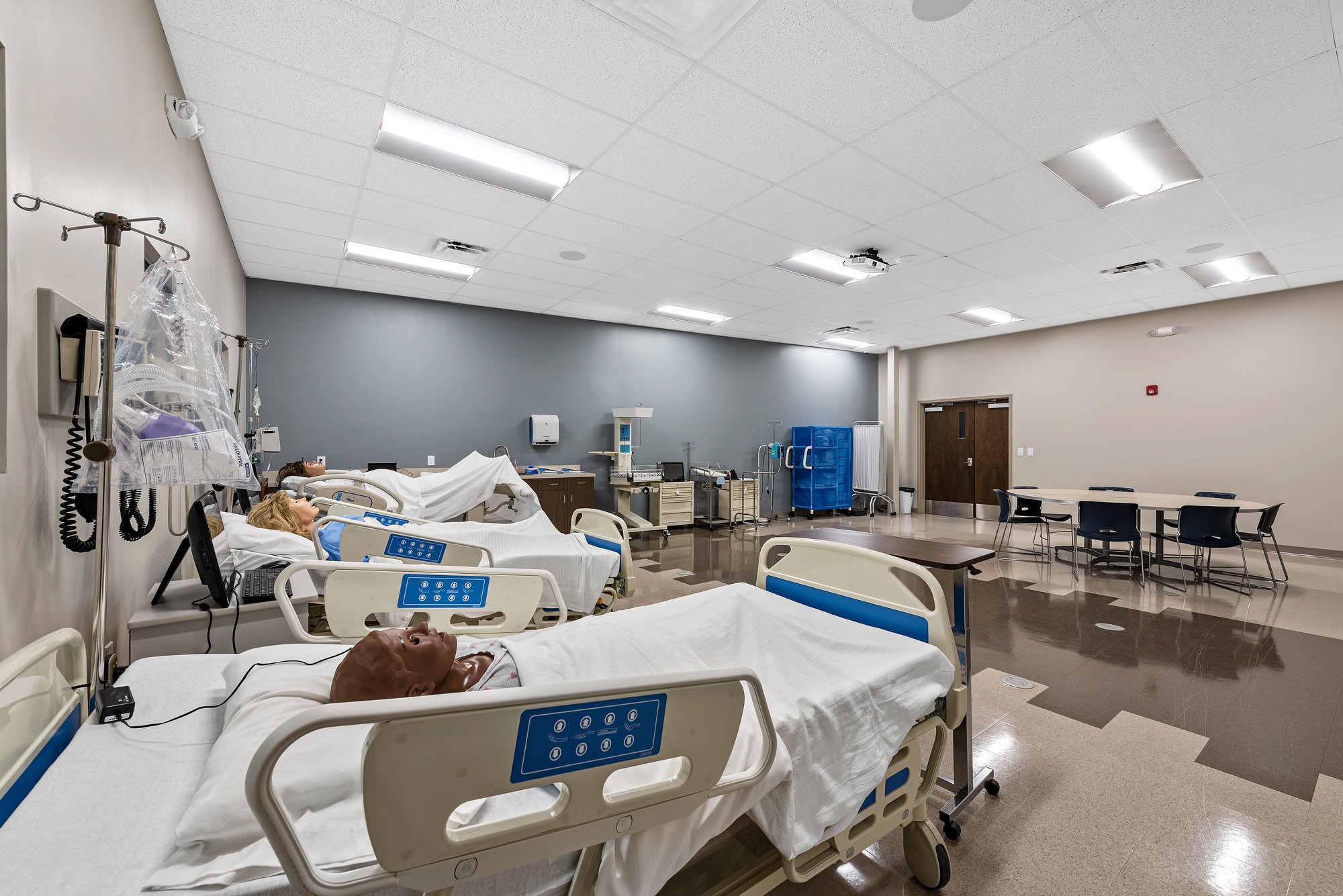 Dental clinic treatment room with chairs and equipment