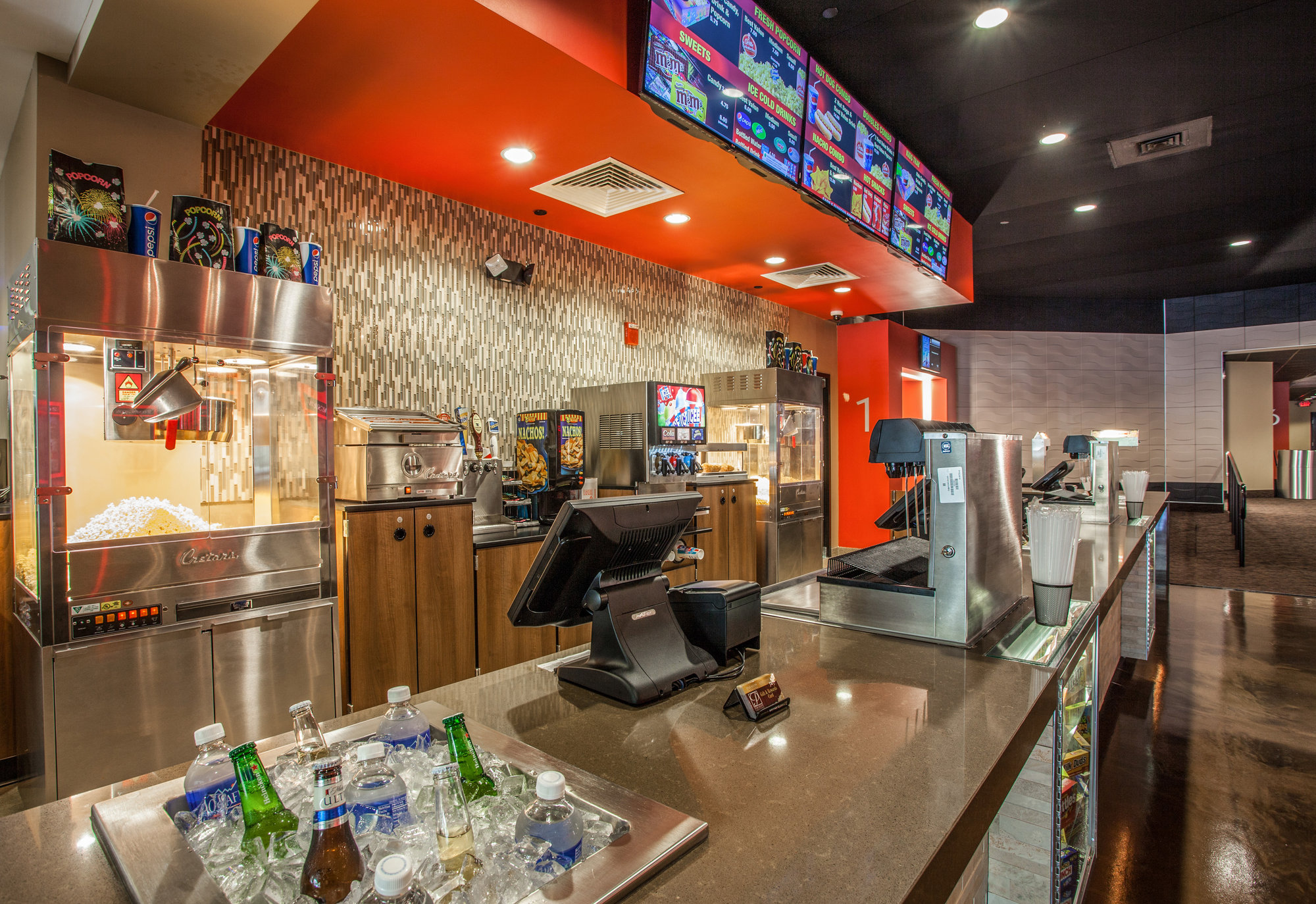 Restaurant bar with red accents and warm lighting