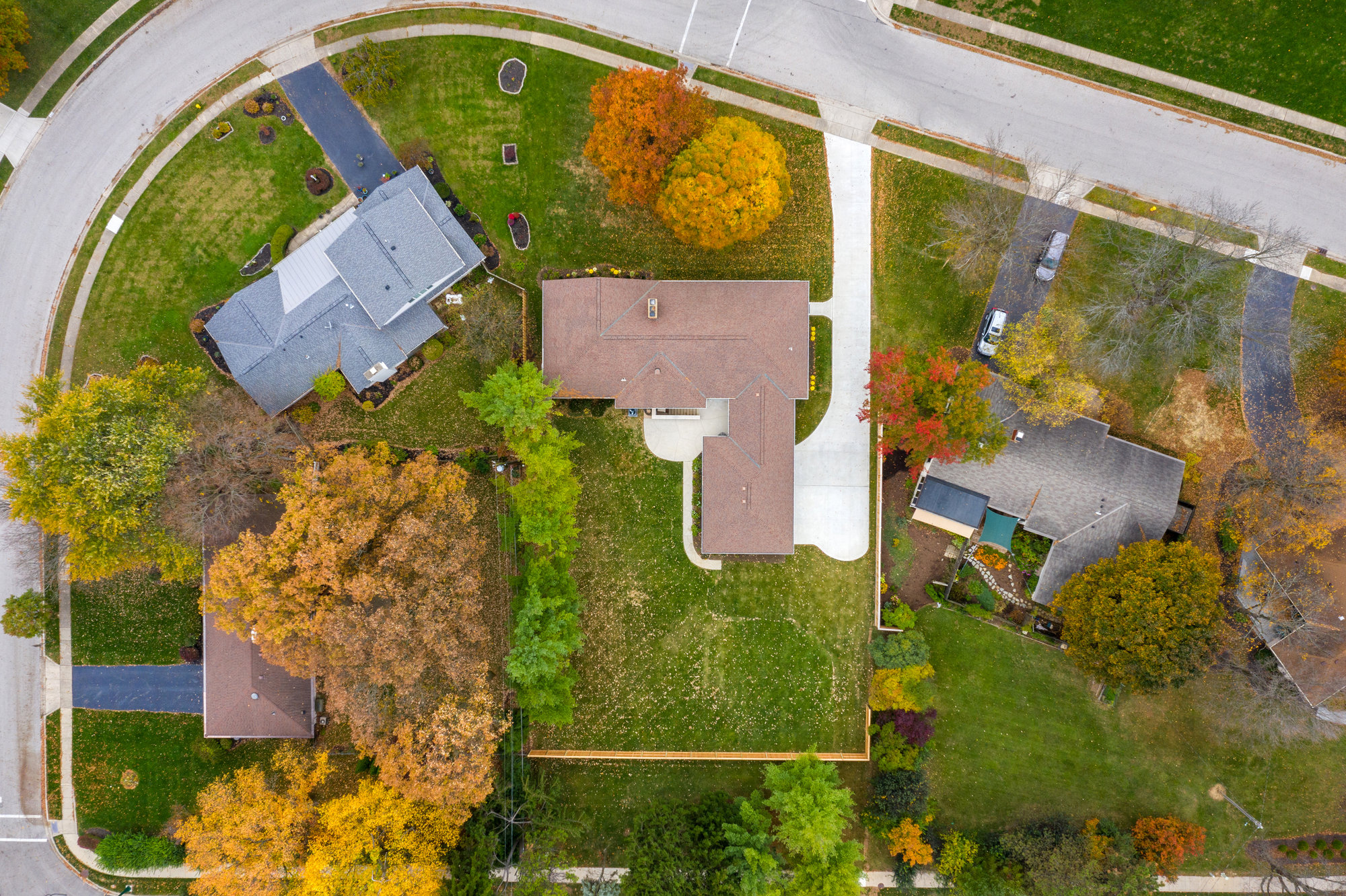 Overhead aerial view of a home and grounds with property boundaries marked