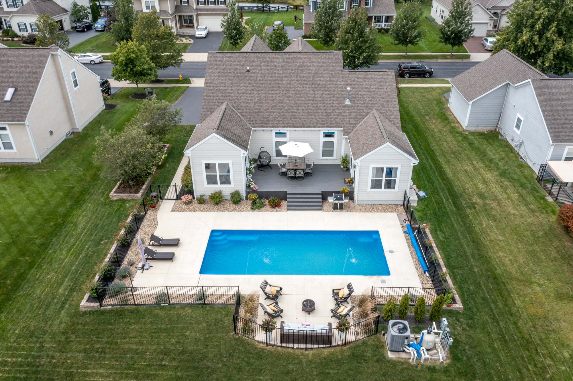 Aerial view of a home and backyard pool