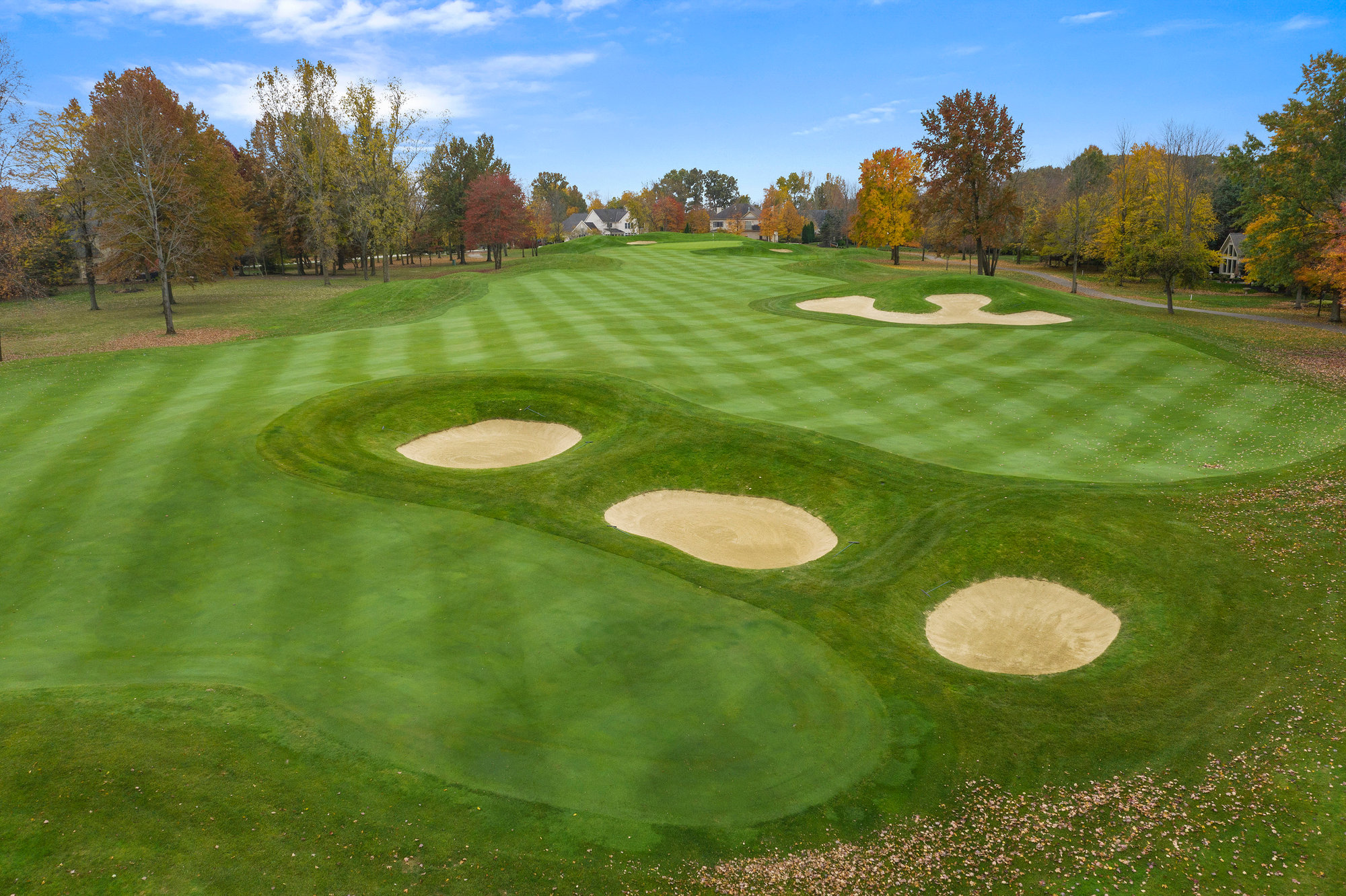 Aerial view of golf course greens and bunkers